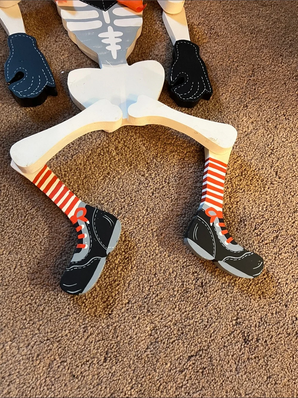 Skeleton Wood Decor with Orange Accents